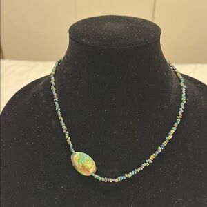 Abalone bead off center on Beaded Necklace with Agate Pendant